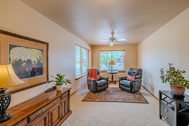 2392 Manzano Loop NE, Rio Rancho, NM 87144 - sitting room featuring carpet, ceiling fan, and baseboards
