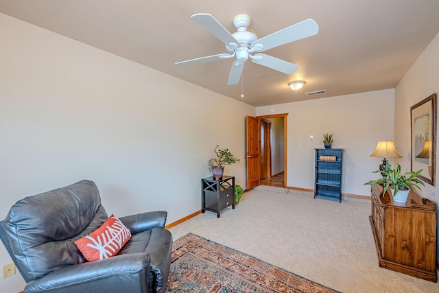 2392 Manzano Loop NE, Rio Rancho, NM 87144 - living area featuring light carpet, ceiling fan, and baseboards