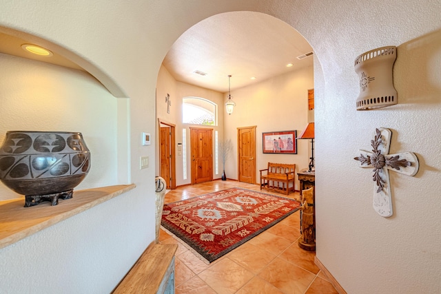 2392 Manzano Loop NE, Rio Rancho, NM 87144 - entrance foyer with arched walkways and light tile patterned flooring