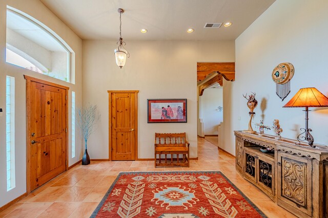 2392 Manzano Loop NE, Rio Rancho, NM 87144 - foyer entrance featuring light tile patterned floors, recessed lighting, plenty of natural light, and baseboards