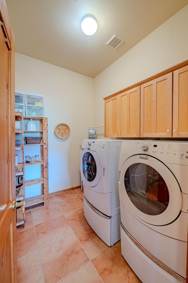 2392 Manzano Loop NE, Rio Rancho, NM 87144 - laundry area with washer and dryer, cabinet space, and a textured ceiling