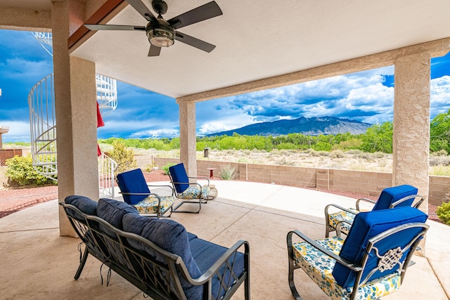 2392 Manzano Loop NE, Rio Rancho, NM 87144 - view of patio with a mountain view, a fenced backyard, ceiling fan, and stairs