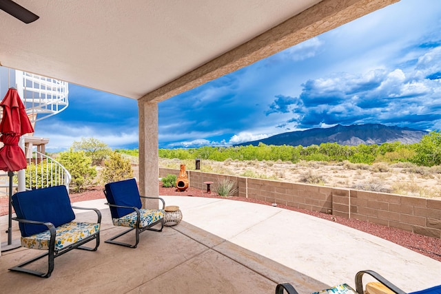 2392 Manzano Loop NE, Rio Rancho, NM 87144 - view of patio with a mountain view and a fenced backyard