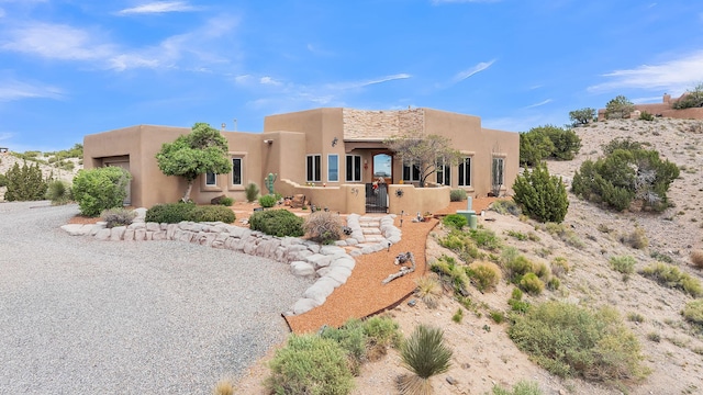 59 Sky Mountain Rd, Placitas, NM 87043 - pueblo-style house with stucco siding