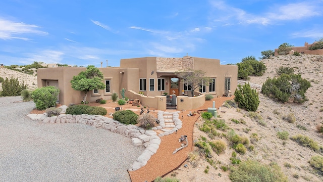 59 Sky Mountain Rd, Placitas, NM 87043 - pueblo-style home featuring stucco siding