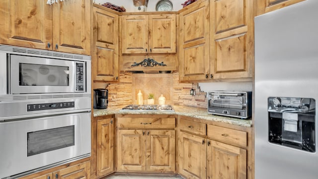 59 Sky Mountain Rd, Placitas, NM 87043 - kitchen with stainless steel appliances, light stone counters, and tasteful backsplash