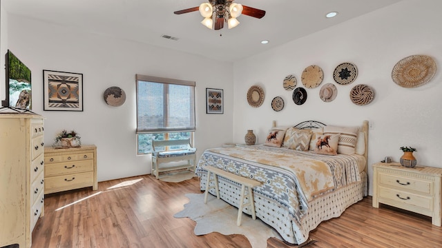 59 Sky Mountain Rd, Placitas, NM 87043 - bedroom with wood finished floors, recessed lighting, and ceiling fan
