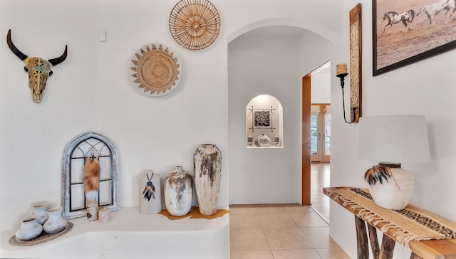 59 Sky Mountain Rd, Placitas, NM 87043 - corridor featuring arched walkways and light tile patterned floors
