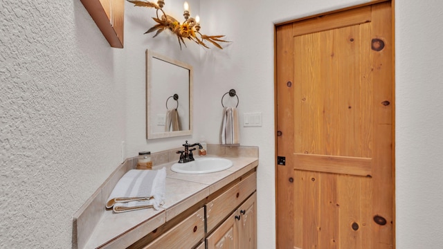 59 Sky Mountain Rd, Placitas, NM 87043 - bathroom with vanity and a textured wall