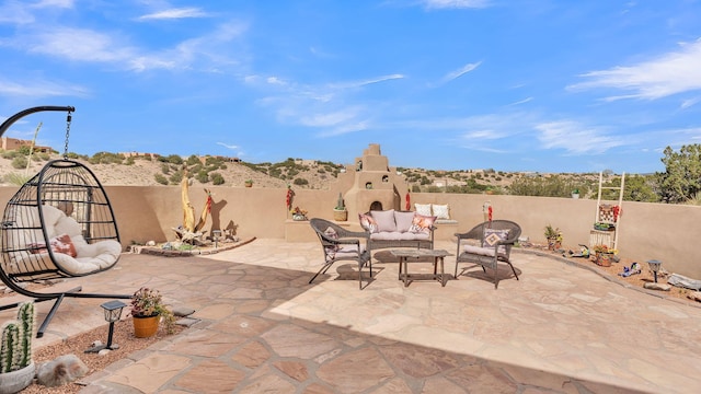 59 Sky Mountain Rd, Placitas, NM 87043 - view of patio with an outdoor living space with a fireplace and fence