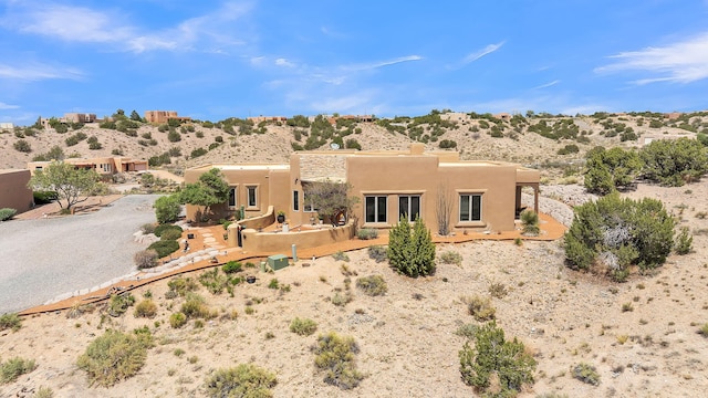 59 Sky Mountain Rd, Placitas, NM 87043 - view of front of house featuring view of desert and stucco siding