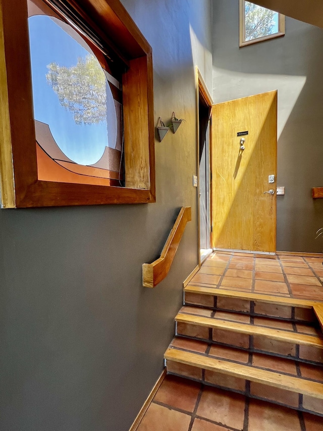 52 Tejon Canon Rd, Placitas, NM 87043 - stairway with baseboards and tile patterned floors