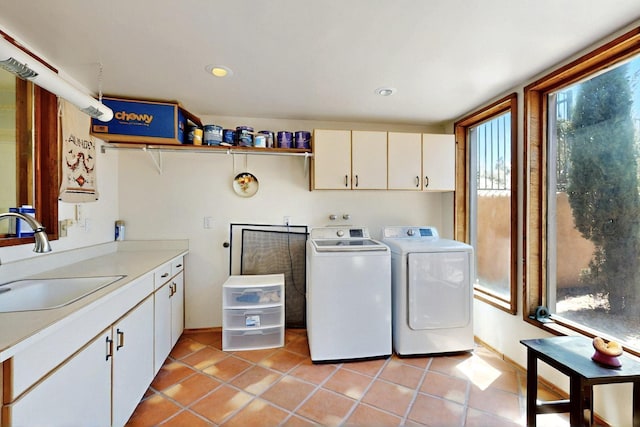 52 Tejon Canon Rd, Placitas, NM 87043 - laundry room with cabinet space, washer and dryer, healthy amount of natural light, light tile patterned floors, and recessed lighting