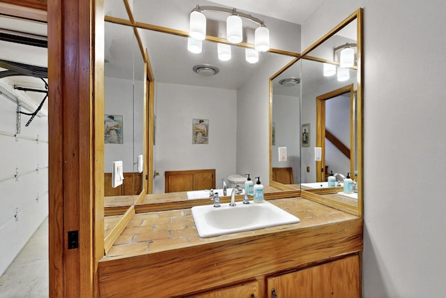 52 Tejon Canon Rd, Placitas, NM 87043 - bathroom featuring toilet, vanity, and concrete flooring