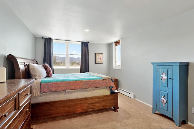 52 Tejon Canon Rd, Placitas, NM 87043 - bedroom with a baseboard heating unit, light colored carpet, and baseboards