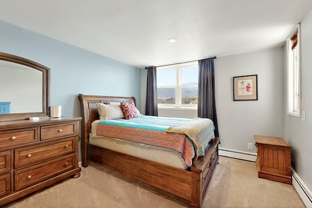 52 Tejon Canon Rd, Placitas, NM 87043 - bedroom featuring light colored carpet, a baseboard heating unit, and baseboards