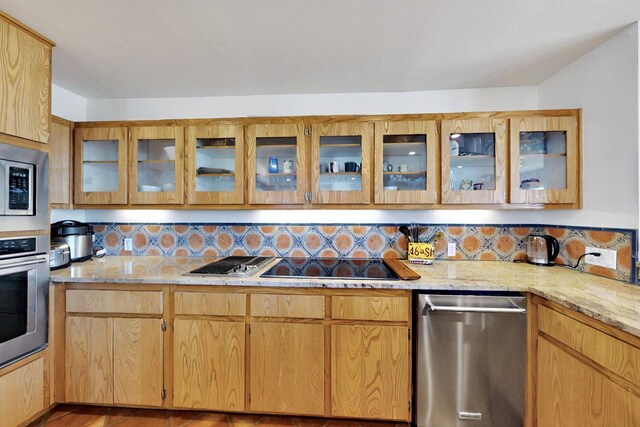 52 Tejon Canon Rd, Placitas, NM 87043 - kitchen featuring stainless steel appliances, backsplash, light stone counters, and glass insert cabinets