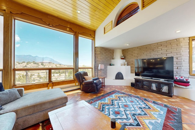 52 Tejon Canon Rd, Placitas, NM 87043 - living area featuring plenty of natural light, baseboard heating, and tile patterned floors