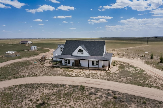420 Bassett Blvd, Edgewood, NM 87015 - view of front of house featuring curved driveway, a view of rural / pastoral area, and a porch