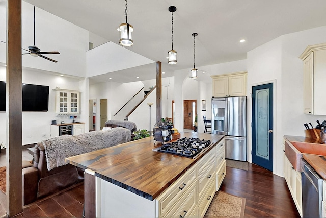 420 Bassett Blvd, Edgewood, NM 87015 - kitchen featuring cream cabinets, stainless steel appliances, open floor plan, wooden counters, and recessed lighting