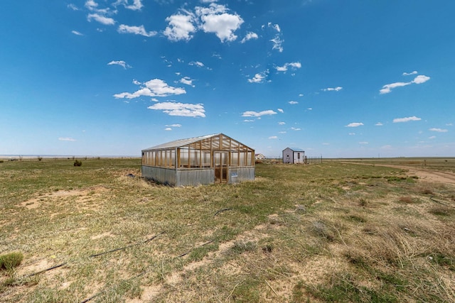 420 Bassett Blvd, Edgewood, NM 87015 - view of yard featuring an exterior structure, an outbuilding, and a view of rural / pastoral area
