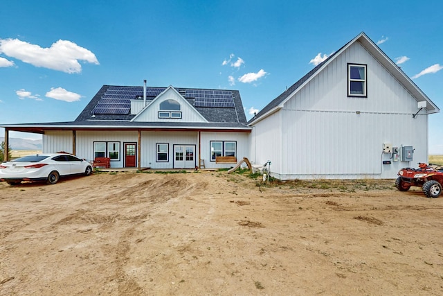 420 Bassett Blvd, Edgewood, NM 87015 - view of front of house featuring roof mounted solar panels and a shingled roof