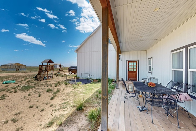 420 Bassett Blvd, Edgewood, NM 87015 - deck featuring a playground and outdoor dining area
