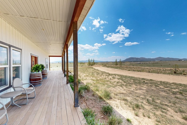 420 Bassett Blvd, Edgewood, NM 87015 - deck with a mountain view, a porch, and a view of countryside