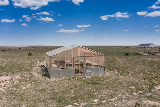 420 Bassett Blvd, Edgewood, NM 87015 - back of house with an exterior structure, an outbuilding, and a view of rural / pastoral area