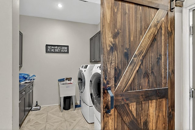 420 Bassett Blvd, Edgewood, NM 87015 - laundry area featuring a barn door, washing machine and dryer, and cabinet space
