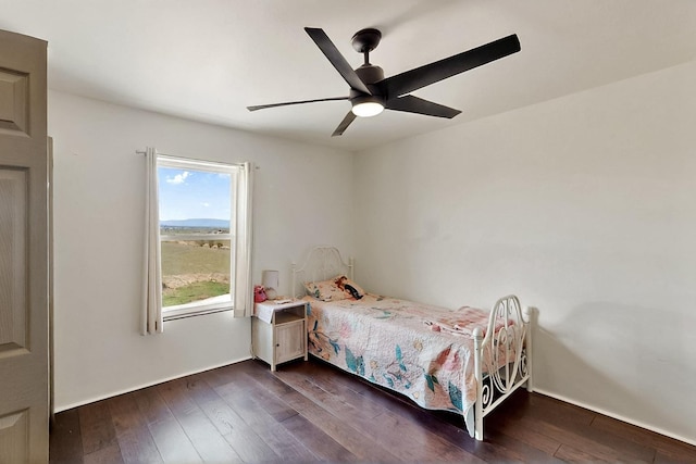 420 Bassett Blvd, Edgewood, NM 87015 - bedroom with dark wood-style flooring, a ceiling fan, and baseboards