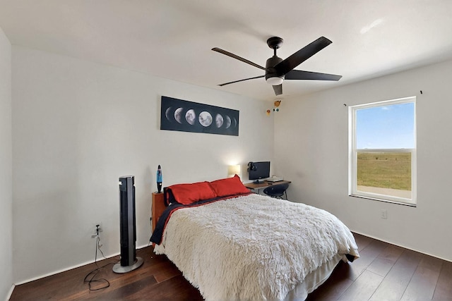 420 Bassett Blvd, Edgewood, NM 87015 - bedroom featuring wood finished floors, a ceiling fan, and a desk