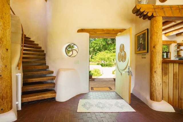 59 Perdiz Canyon Rd, Placitas, NM 87043 - foyer entrance featuring brick flooring and stairway