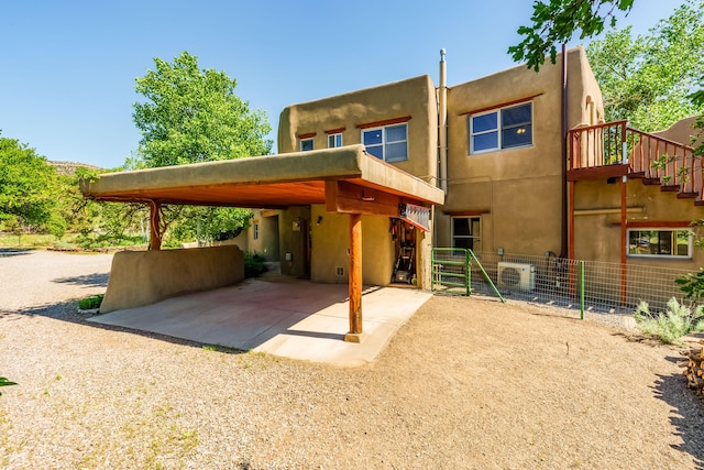 59 Perdiz Canyon Rd, Placitas, NM 87043 - rear view of property with stucco siding