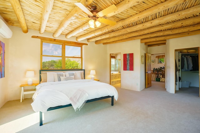 59 Perdiz Canyon Rd, Placitas, NM 87043 - bedroom featuring wooden ceiling with exposed beams, light colored carpet, ensuite bath, a wall mounted AC, and a walk in closet