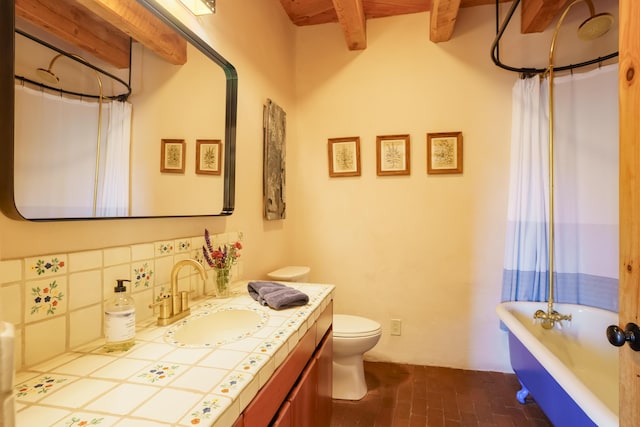 59 Perdiz Canyon Rd, Placitas, NM 87043 - full bathroom with brick patterned flooring, vanity, toilet, and beam ceiling