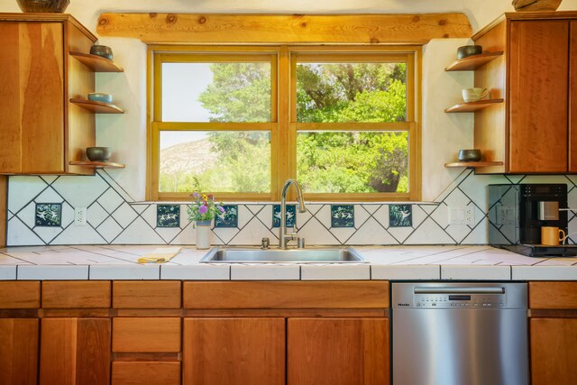 59 Perdiz Canyon Rd, Placitas, NM 87043 - kitchen featuring open shelves, dishwasher, a sink, tile counters, and tasteful backsplash
