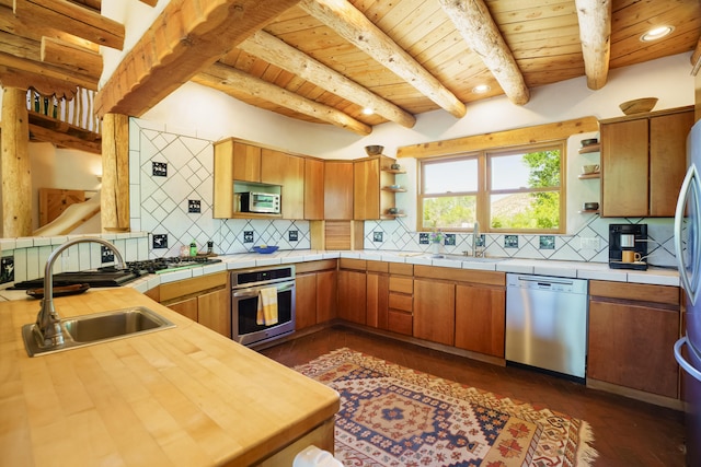 59 Perdiz Canyon Rd, Placitas, NM 87043 - kitchen featuring appliances with stainless steel finishes, open shelves, wood ceiling with exposed beams, a sink, and tasteful backsplash