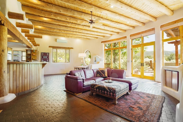 59 Perdiz Canyon Rd, Placitas, NM 87043 - living area with brick flooring, wood ceiling with exposed beams, french doors, a ceiling fan, and a wall mounted AC