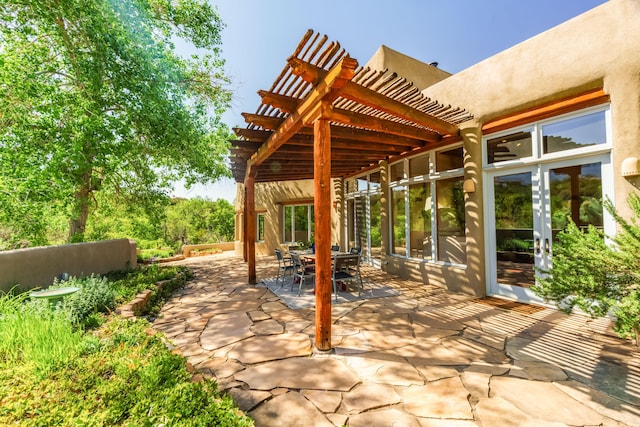 59 Perdiz Canyon Rd, Placitas, NM 87043 - view of patio featuring a pergola and french doors