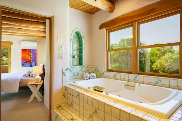 59 Perdiz Canyon Rd, Placitas, NM 87043 - ensuite bathroom featuring a jetted tub, healthy amount of natural light, and wood ceiling with exposed beams