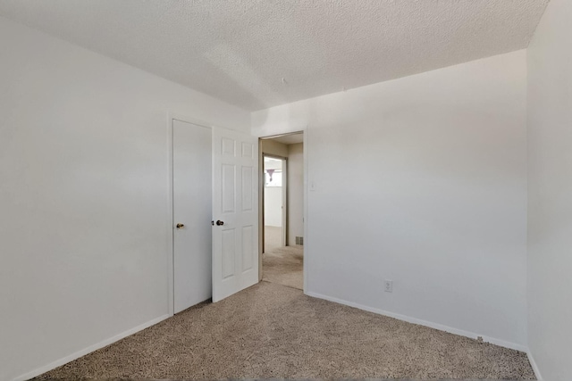1614 Del Monte Trl SW, Albuquerque, NM 87121 - carpeted spare room featuring baseboards and a textured ceiling