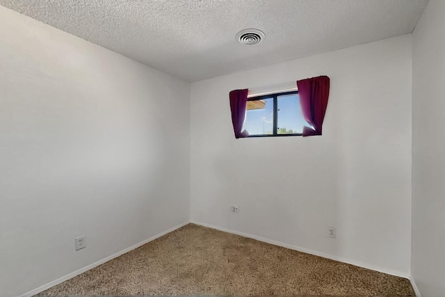 1614 Del Monte Trl SW, Albuquerque, NM 87121 - spare room with carpet flooring, baseboards, and a textured ceiling