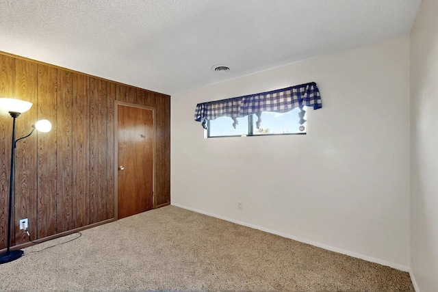 1614 Del Monte Trl SW, Albuquerque, NM 87121 - unfurnished bedroom featuring wood walls, carpet floors, and baseboards