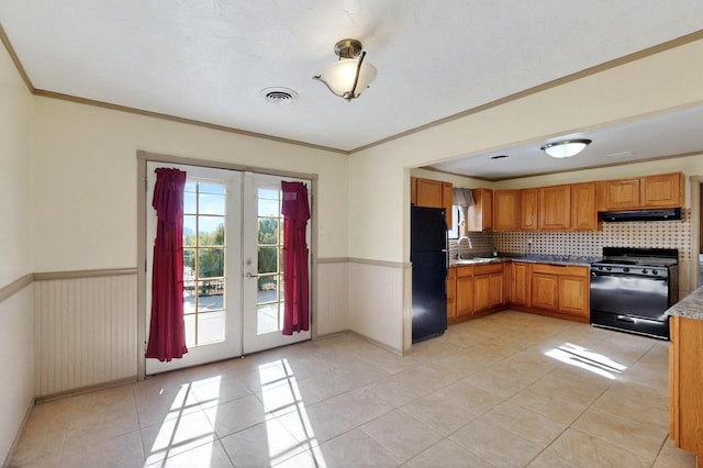 1614 Del Monte Trl SW, Albuquerque, NM 87121 - kitchen featuring black appliances, exhaust hood, a sink, tasteful backsplash, and french doors