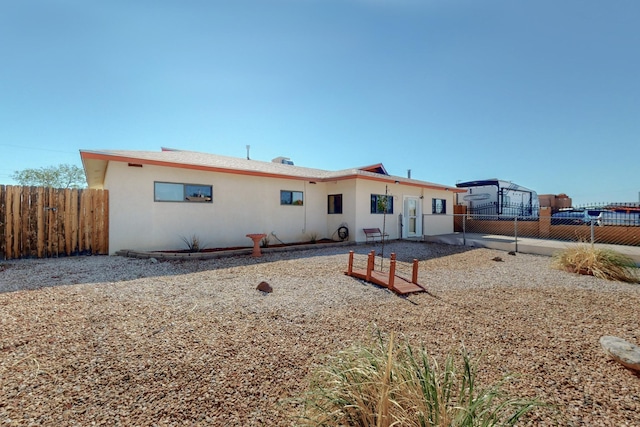 1614 Del Monte Trl SW, Albuquerque, NM 87121 - rear view of property featuring fence and stucco siding