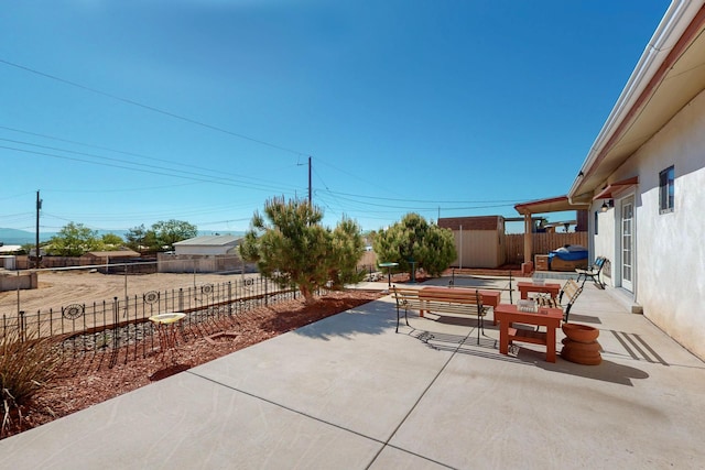 1614 Del Monte Trl SW, Albuquerque, NM 87121 - view of patio featuring a storage shed, an outdoor structure, and a fenced backyard