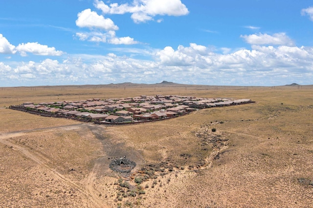 6808 Vista Luces St NW, Albuquerque, NM 87120 - aerial view of sparsely populated area featuring nearby suburban area and a mountainous background