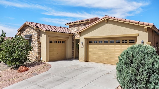 729 Sierra Verde Way NE, Rio Rancho, NM 87124 - mediterranean / spanish home with stucco siding, a tiled roof, stone siding, concrete driveway, and an attached garage