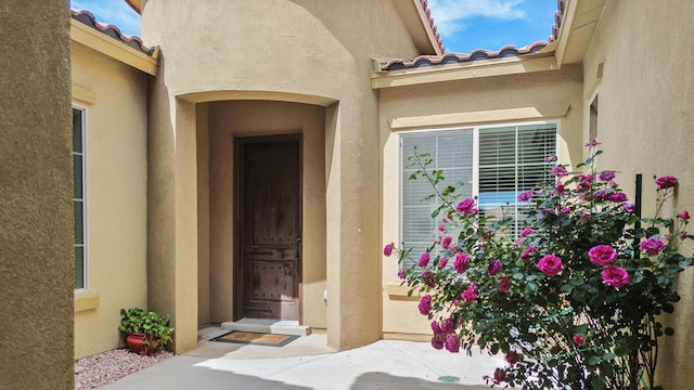 729 Sierra Verde Way NE, Rio Rancho, NM 87124 - property entrance featuring stucco siding and a tile roof